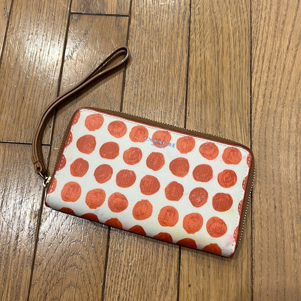 Polka dotted Coach wristlet